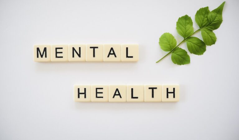 An image featuring a supportive community engaging in mental health awareness activities, with the title "Understanding the Importance of Mental Health Awareness: Shedding Light on Mental Health Issues and Solutions" displayed prominently