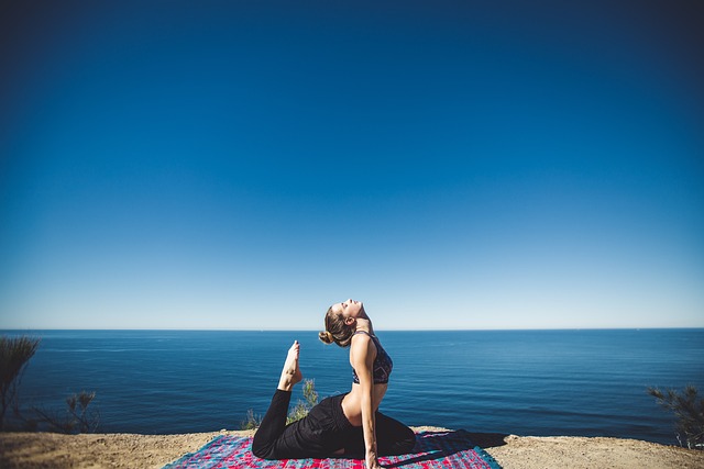 An image featuring a person in a yoga pose with a serene expression, accompanied by the text "Yoga Poses for a Healthy Digestion – Say Goodbye to Bloating.